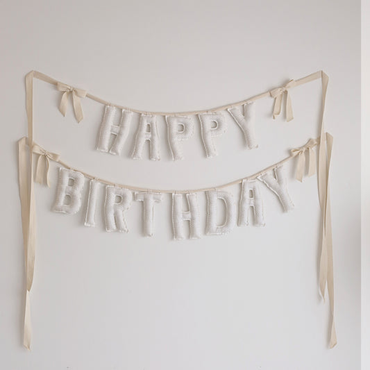 Neutral handmade ‘Happy Birthday’ fabric banner with twill bows – soft cotton garland for birthdays, nurseries, or keepsake gifts by Social Heirloom