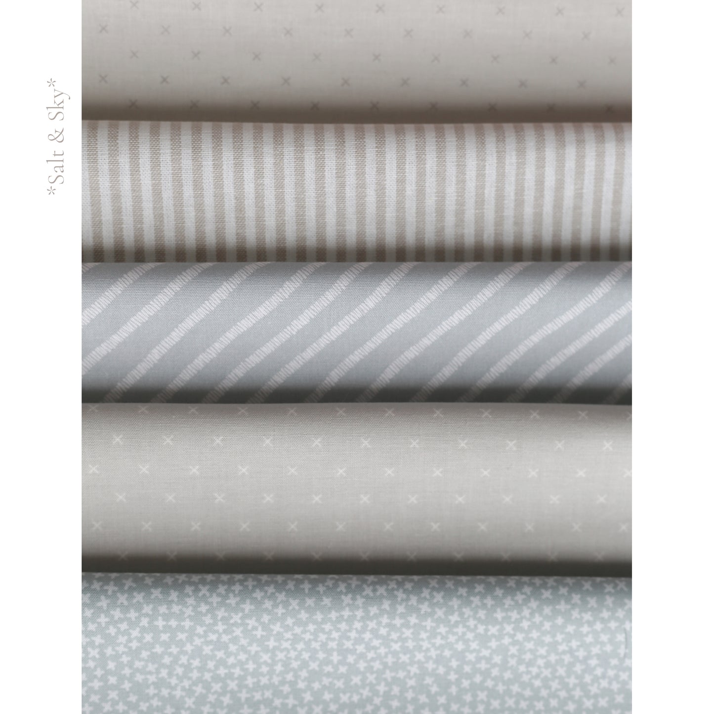 Salt and Sky fabric palette by Social Heirloom – soft blues, cool greys, and warm taupe stripes and prints used in handmade birthday and name garlands for nurseries, gifts, and first birthdays