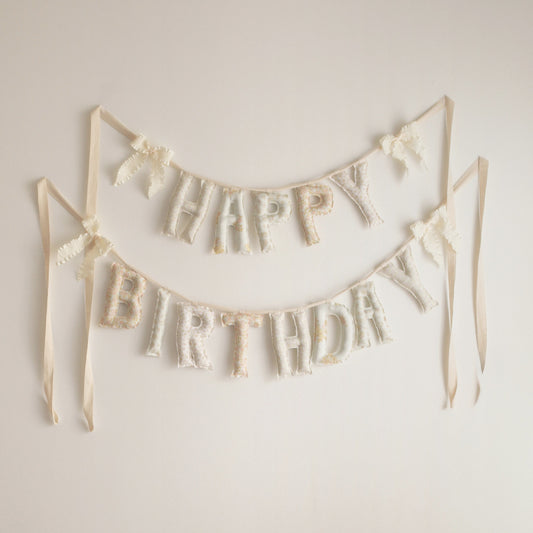 Honey & Bloom Happy Birthday garland by Social Heirloom, handmade fabric letters in pale vintage florals of blush, cream and buttery yellow